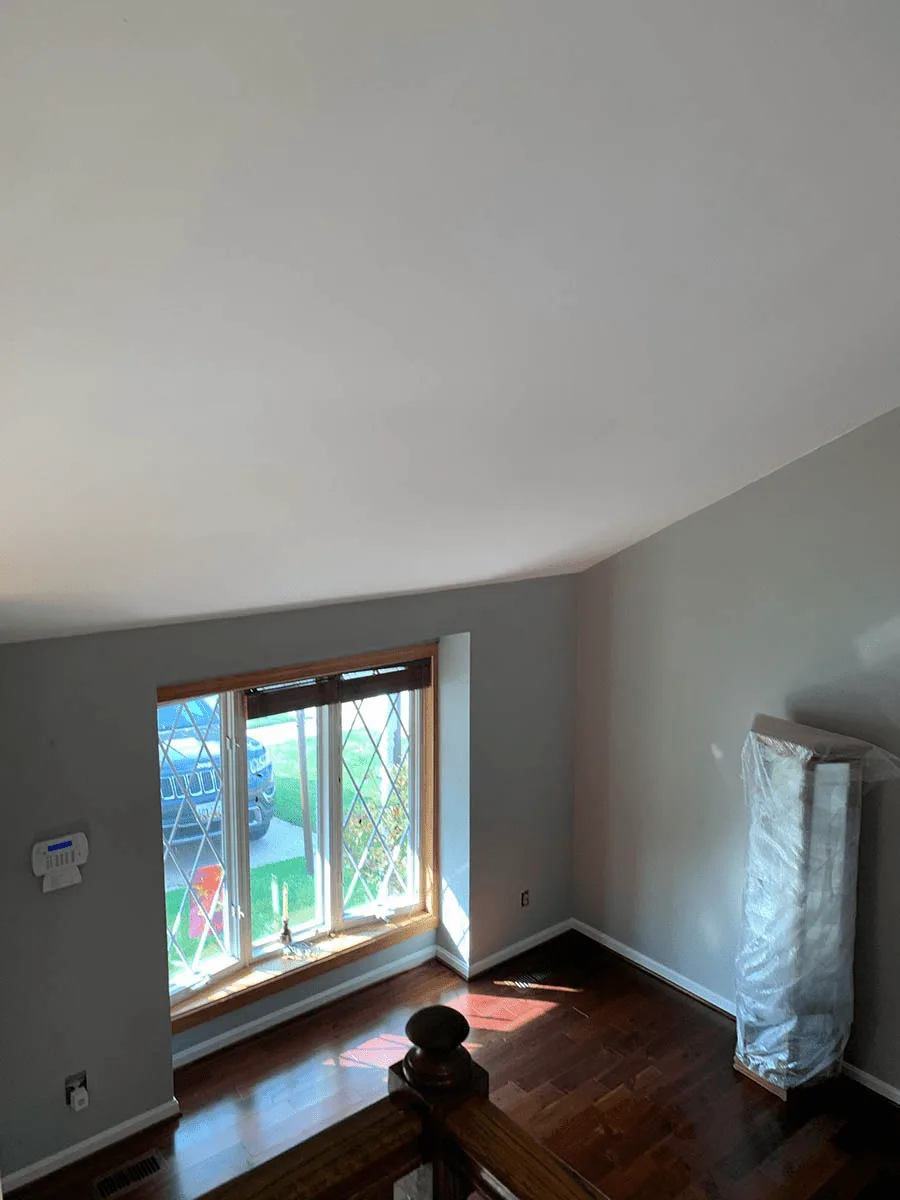 Bedroom repainted in light gray