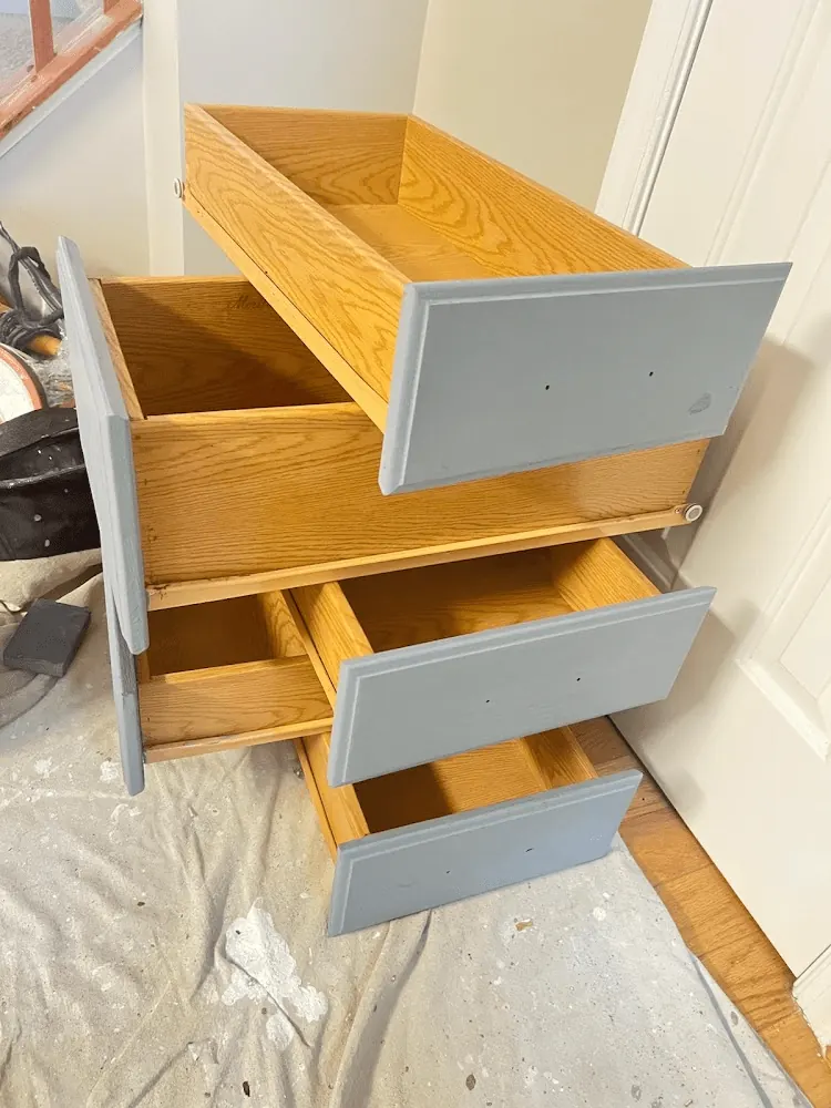 Cabinet drawers being painted gray
